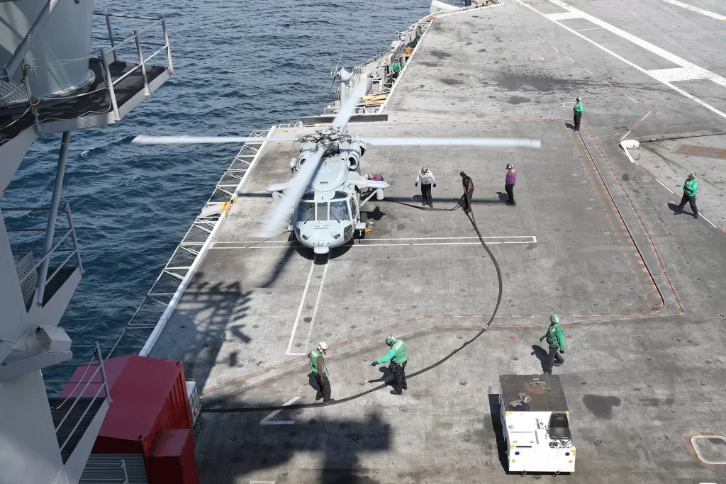 mh 60s and crew on flight deck